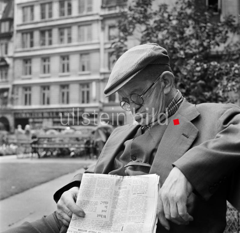 An elderly man asleep with his newspaper, City of London, c1946-c1959. Artist: John Gay